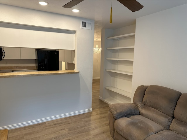 6036 Birchbrook Dr Unit 127, Dallas, TX 75206 - living area featuring a ceiling fan, wood finished floors, and recessed lighting