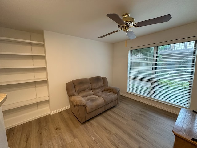 6036 Birchbrook Dr Unit 127, Dallas, TX 75206 - sitting room featuring wood finished floors and a ceiling fan