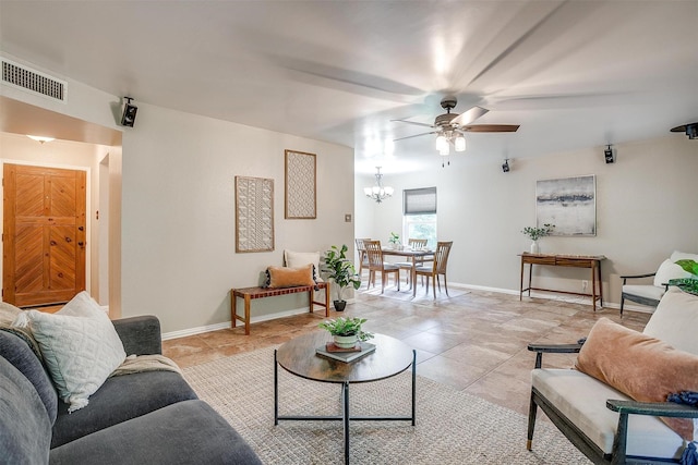221 Sierra Dr, Joshua, TX 76058 - living room with ceiling fan, a chandelier, and light tile patterned floors