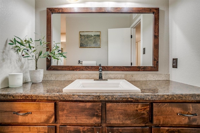 221 Sierra Dr, Joshua, TX 76058 - bathroom featuring vanity and a textured wall