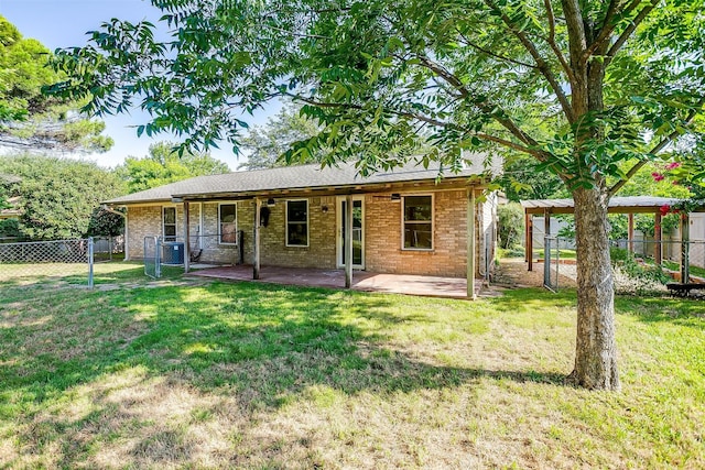 221 Sierra Dr, Joshua, TX 76058 - rear view of house with a fenced backyard, a patio, and brick siding
