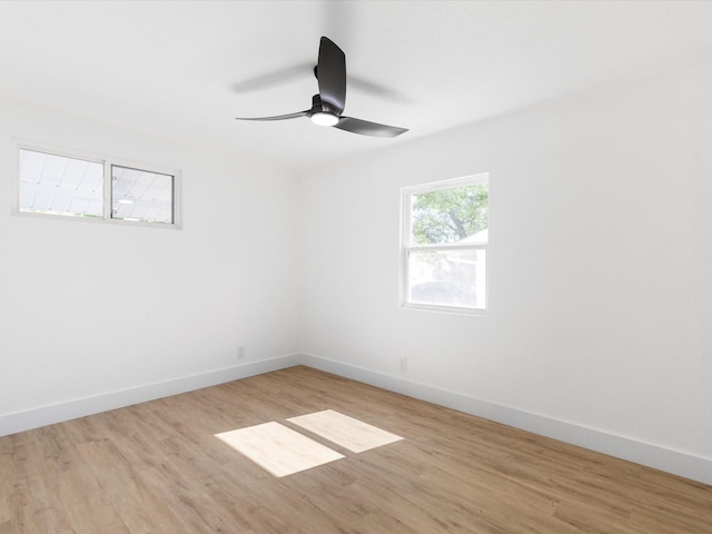 1910 Durham St, Irving, TX 75062 - unfurnished room with light wood-style flooring and ceiling fan