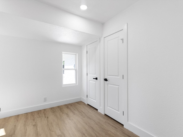 1910 Durham St, Irving, TX 75062 - unfurnished bedroom featuring light wood-type flooring and baseboards