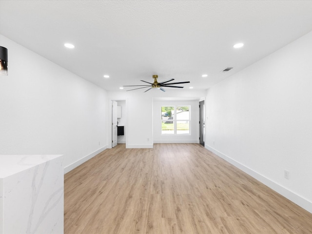 1910 Durham St, Irving, TX 75062 - unfurnished living room with recessed lighting, light wood-style flooring, and a ceiling fan