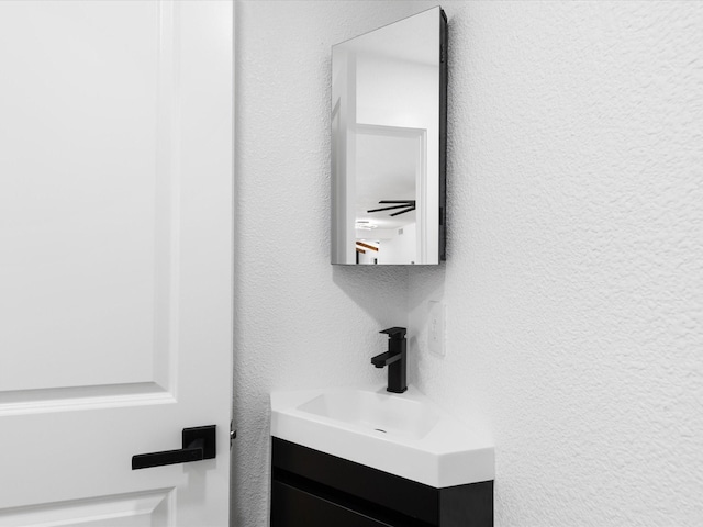 1910 Durham St, Irving, TX 75062 - bathroom view of vanity and a textured wall