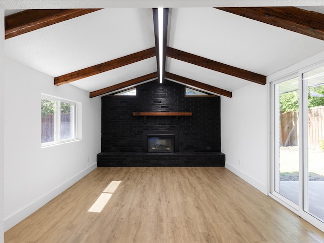 1910 Durham St, Irving, TX 75062 - unfurnished living room featuring wood finished floors and a fireplace