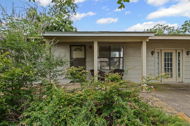 504 Cozby St N, Benbrook, TX 76126 - doorway to property featuring covered porch