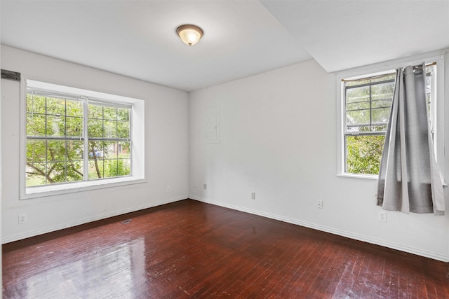 504 Cozby St N, Benbrook, TX 76126 - spare room with plenty of natural light and wood finished floors