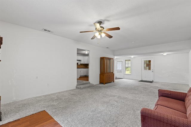504 Cozby St N, Benbrook, TX 76126 - carpeted living area featuring a ceiling fan and baseboards