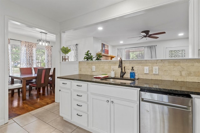 717 Thersa Dr, River Oaks, TX 76114 - kitchen featuring stainless steel dishwasher, light tile patterned floors, plenty of natural light, dark stone counters, and recessed lighting