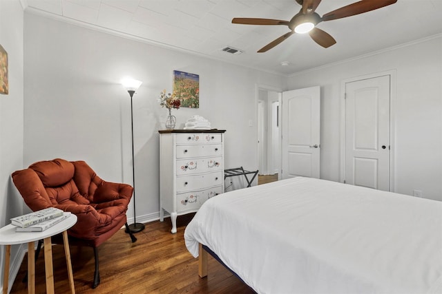 717 Thersa Dr, River Oaks, TX 76114 - bedroom with wood finished floors, ornamental molding, and ceiling fan