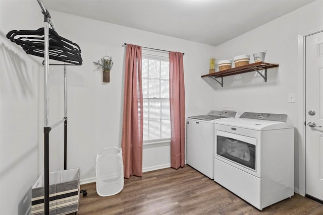 717 Thersa Dr, River Oaks, TX 76114 - washroom featuring washing machine and clothes dryer and wood finished floors
