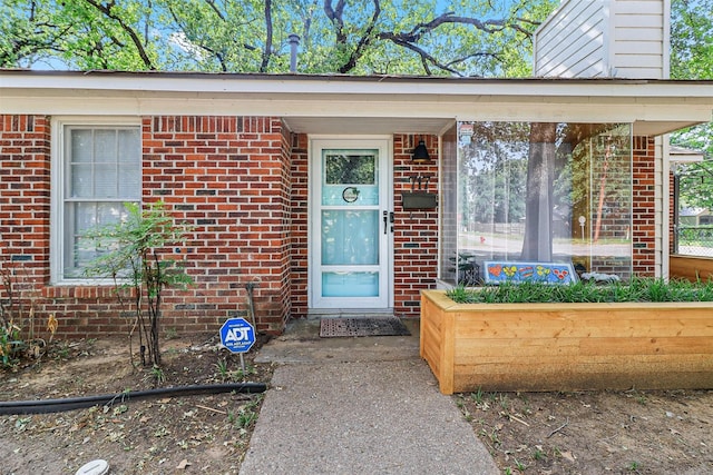 717 Thersa Dr, River Oaks, TX 76114 - entrance to property with brick siding and a chimney