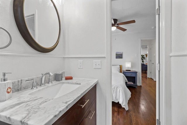717 Thersa Dr, River Oaks, TX 76114 - ensuite bathroom featuring vanity, a ceiling fan, wood finished floors, and crown molding