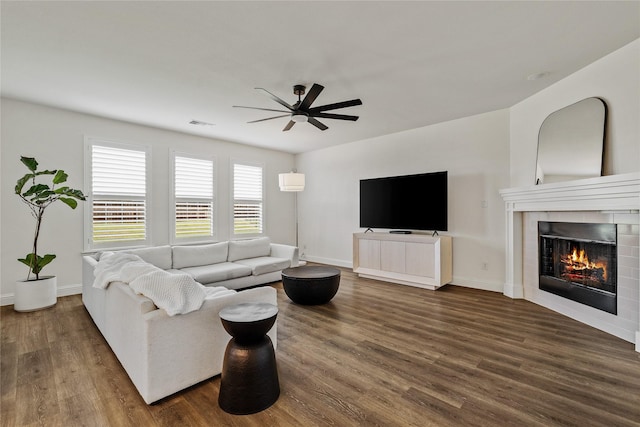 1430 Shaker Hills Rd, Gunter, TX 75058 - living room featuring a ceiling fan, dark wood finished floors, and a tiled fireplace
