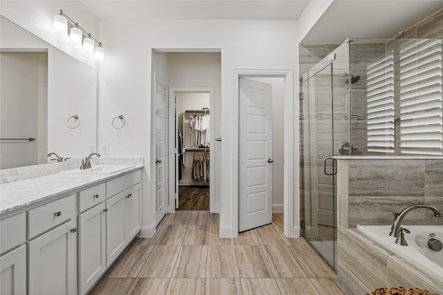 1430 Shaker Hills Rd, Gunter, TX 75058 - bathroom featuring vanity, a garden tub, a shower stall, and a walk in closet