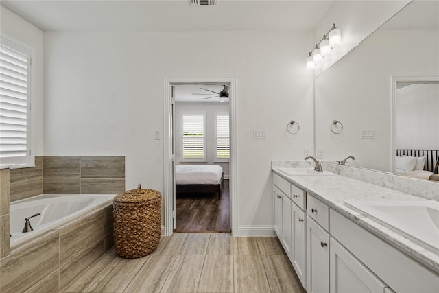 1430 Shaker Hills Rd, Gunter, TX 75058 - ensuite bathroom featuring double vanity, a garden tub, and tile patterned floors