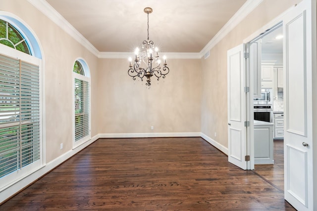 5913 Kensington Dr, Plano, TX 75093 - unfurnished dining area with a chandelier, dark wood-style flooring, and crown molding