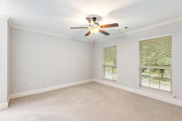 5913 Kensington Dr, Plano, TX 75093 - spare room with light carpet, ornamental molding, and a ceiling fan