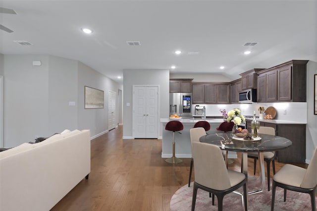 5524 Santa Elena Ct, Fort Worth, TX 76126 - dining area with dark wood-style flooring, recessed lighting, and vaulted ceiling
