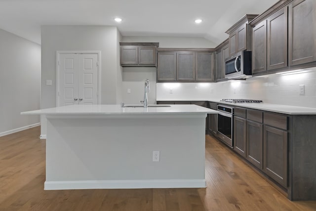 5524 Santa Elena Ct, Fort Worth, TX 76126 - kitchen featuring stainless steel appliances, an island with sink, backsplash, light countertops, and recessed lighting