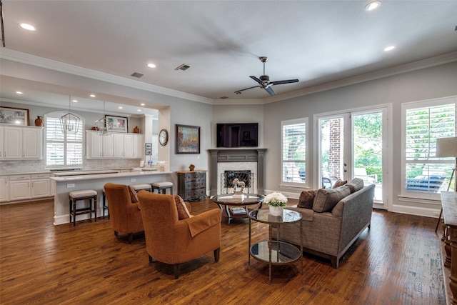 4637 Biltmoore Dr, Frisco, TX 75034 - living area with dark wood-type flooring, a fireplace, a ceiling fan, recessed lighting, and ornamental molding