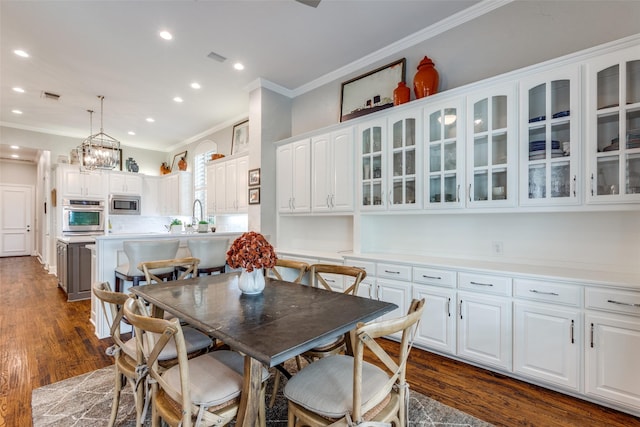 4637 Biltmoore Dr, Frisco, TX 75034 - dining space featuring ornamental molding, recessed lighting, dark wood-style floors, and a chandelier