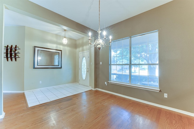 6905 Laurel Canyon Ter, Fort Worth, TX 76132 - foyer with wood finished floors and a chandelier