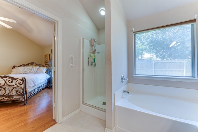 6905 Laurel Canyon Ter, Fort Worth, TX 76132 - full bathroom with vaulted ceiling, connected bathroom, a garden tub, a shower stall, and a ceiling fan