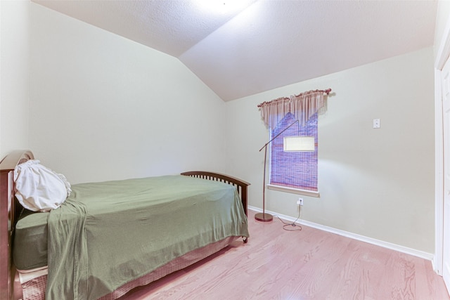 6905 Laurel Canyon Ter, Fort Worth, TX 76132 - bedroom with lofted ceiling and wood finished floors