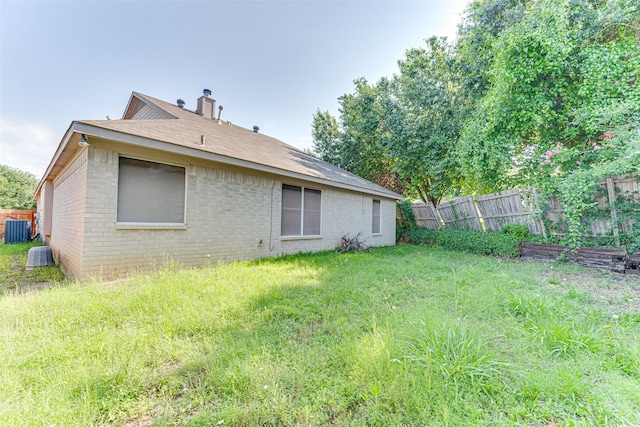 6905 Laurel Canyon Ter, Fort Worth, TX 76132 - rear view of property with brick siding and a chimney