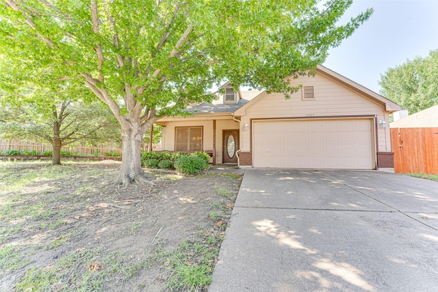 6905 Laurel Canyon Ter, Fort Worth, TX 76132 - view of front facade featuring driveway, brick siding, and an attached garage