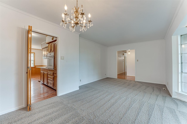 410 Ovilla Rd, Waxahachie, TX 75167 - empty room featuring carpet flooring, crown molding, and a chandelier