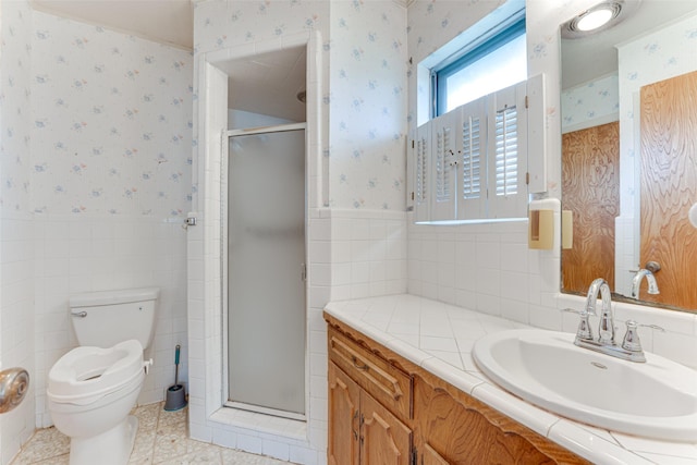 410 Ovilla Rd, Waxahachie, TX 75167 - bathroom with wallpapered walls, a wainscoted wall, vanity, a shower stall, and tile walls