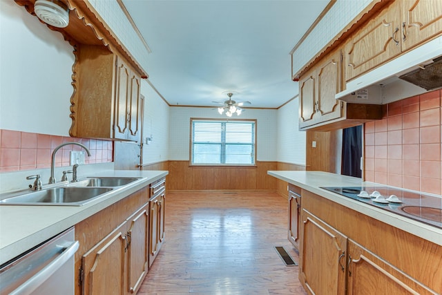 410 Ovilla Rd, Waxahachie, TX 75167 - kitchen featuring stainless steel dishwasher, electric cooktop, light wood-style flooring, under cabinet range hood, and light countertops