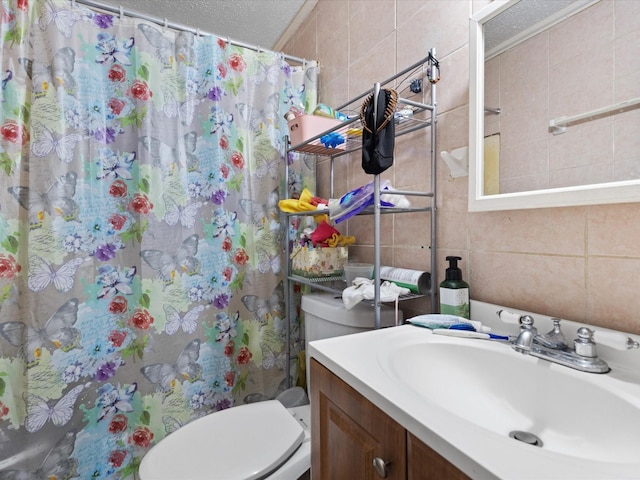 2232 E Kiest Blvd, Dallas, TX 75216 - full bathroom featuring tile walls, vanity, a shower with shower curtain, and a textured ceiling