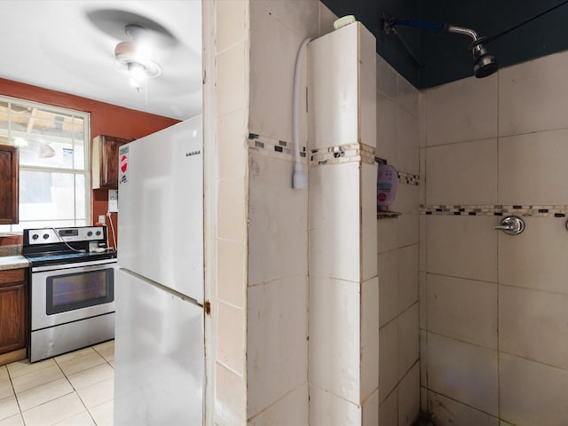 2232 E Kiest Blvd, Dallas, TX 75216 - bathroom featuring vanity, tile patterned floors, and a shower