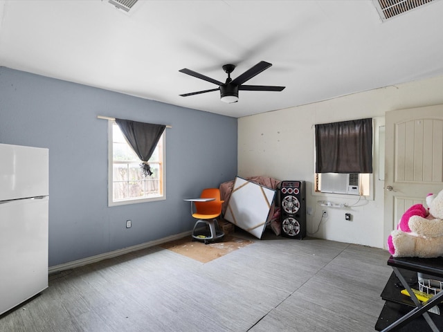 2232 E Kiest Blvd, Dallas, TX 75216 - bedroom featuring freestanding refrigerator, cooling unit, and a ceiling fan