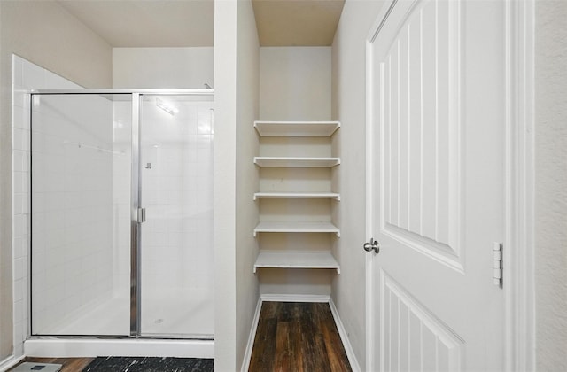 1209 Jasper Xing, Princeton, TX 75407 - bathroom featuring wood finished floors and a stall shower