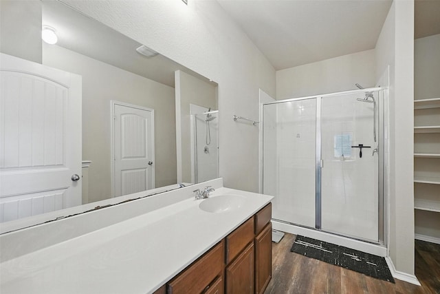 1209 Jasper Xing, Princeton, TX 75407 - bathroom with wood finished floors, a stall shower, and vanity