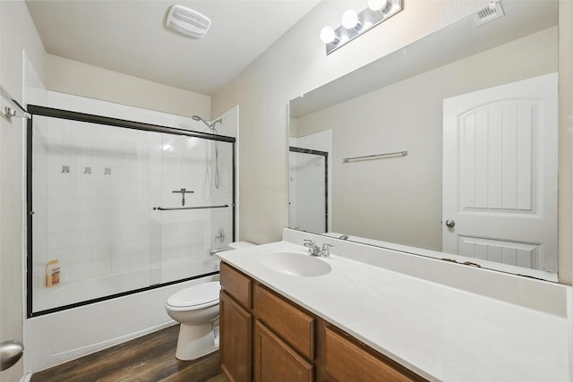 1209 Jasper Xing, Princeton, TX 75407 - full bathroom featuring wood finished floors, bath / shower combo with glass door, and vanity