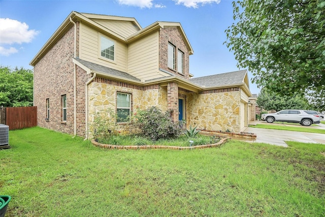 1209 Jasper Xing, Princeton, TX 75407 - traditional home featuring concrete driveway, stone siding, a garage, and roof with shingles
