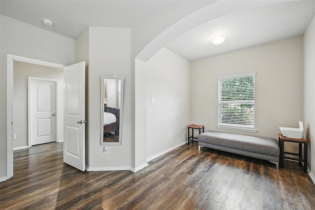 1209 Jasper Xing, Princeton, TX 75407 - sitting room with arched walkways and dark wood finished floors