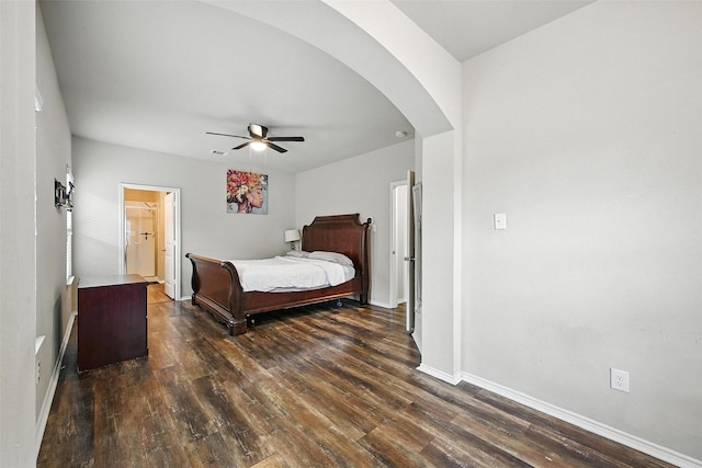 1209 Jasper Xing, Princeton, TX 75407 - bedroom with dark wood-style floors, arched walkways, and a ceiling fan