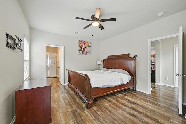 1209 Jasper Xing, Princeton, TX 75407 - bedroom with wood finished floors, a ceiling fan, and connected bathroom