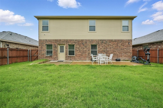 1209 Jasper Xing, Princeton, TX 75407 - back of property with a patio area, a fenced backyard, and brick siding