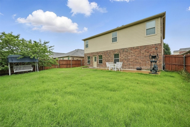 1209 Jasper Xing, Princeton, TX 75407 - rear view of property featuring a fenced backyard and brick siding