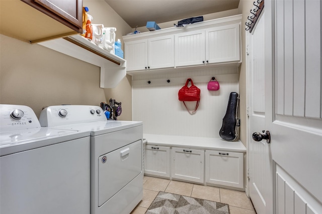 3820 Buchanan St, Mckinney, TX 75071 - washroom featuring washer and clothes dryer, cabinet space, and light tile patterned floors