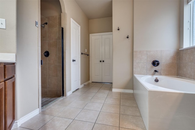 3820 Buchanan St, Mckinney, TX 75071 - bathroom with a bath, a stall shower, tile patterned floors, and vanity