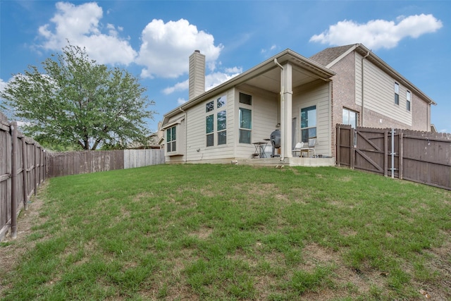 3820 Buchanan St, Mckinney, TX 75071 - back of house with a fenced backyard, a chimney, and a gate